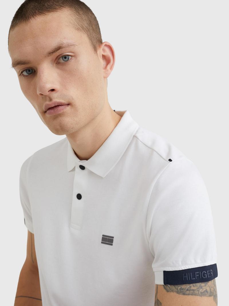 White Tommy Hilfiger Slim fit solid tech Polos | NZ_M31313