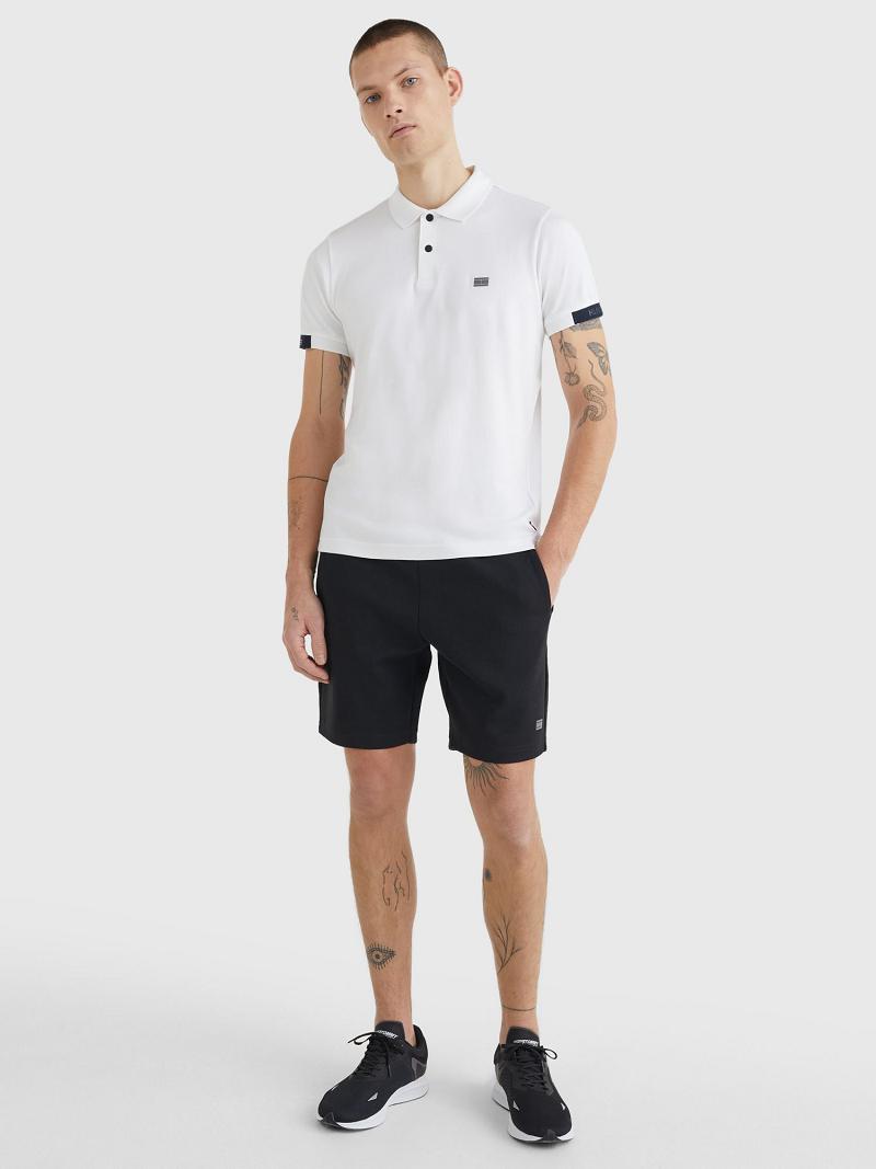 White Tommy Hilfiger Slim fit solid tech Polos | NZ_M31313