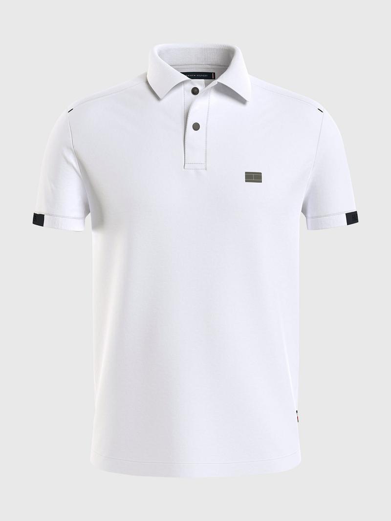 White Tommy Hilfiger Slim fit solid tech Polos | NZ_M31313