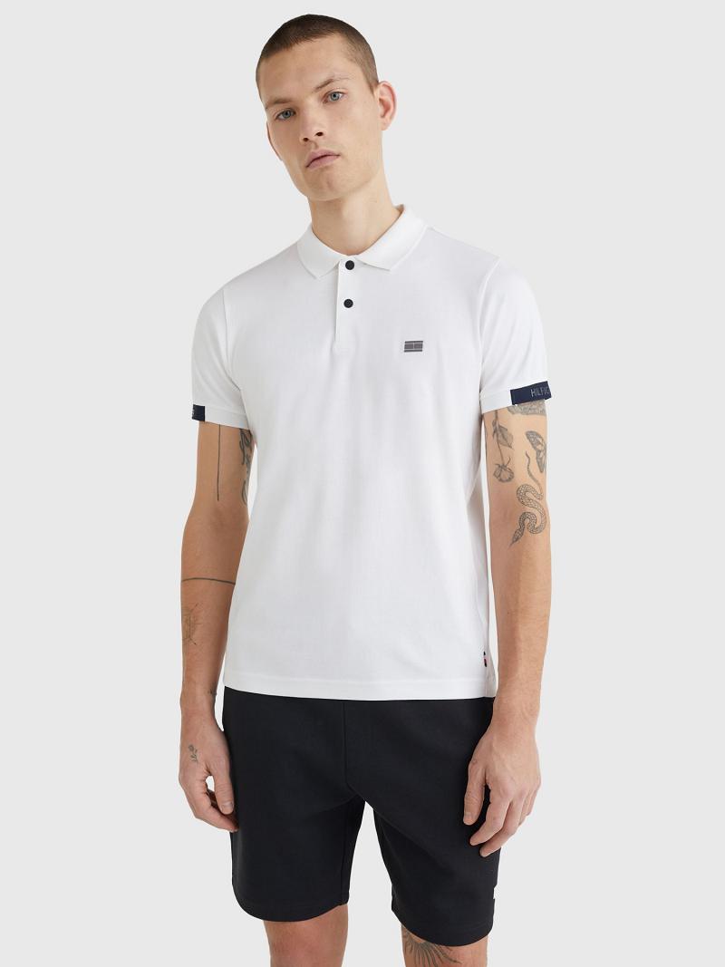 White Tommy Hilfiger Slim fit solid tech Polos | NZ_M31313